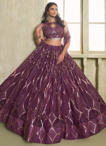 Party wear Trendy Wine colored net Lehenga with sequin embroidered blouse.